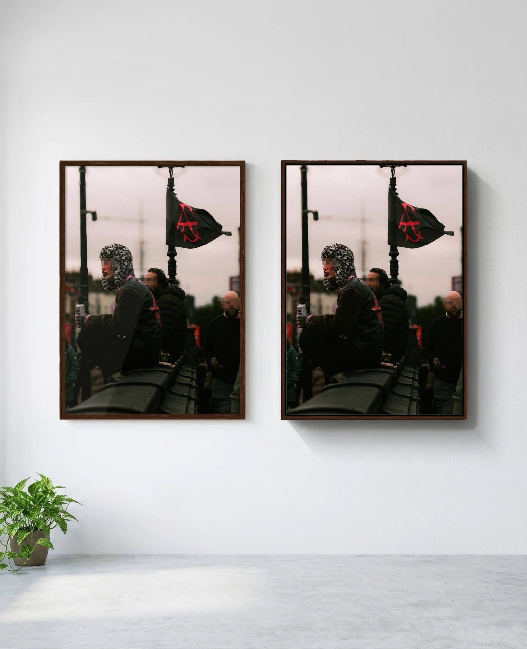 Anarchy art print in brown frame, installed on wall