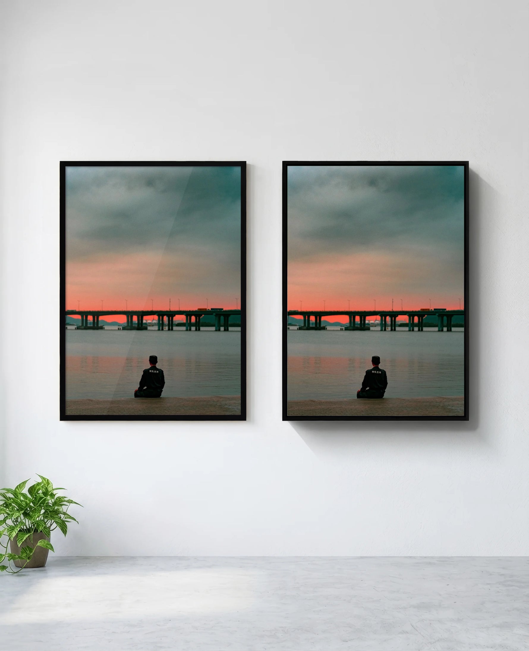 Still art print in black frame, installed on wall