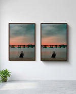 Still art print in brown frame, installed on wall