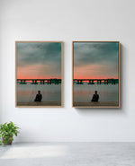 Still art print in natural-wood frame, installed on wall