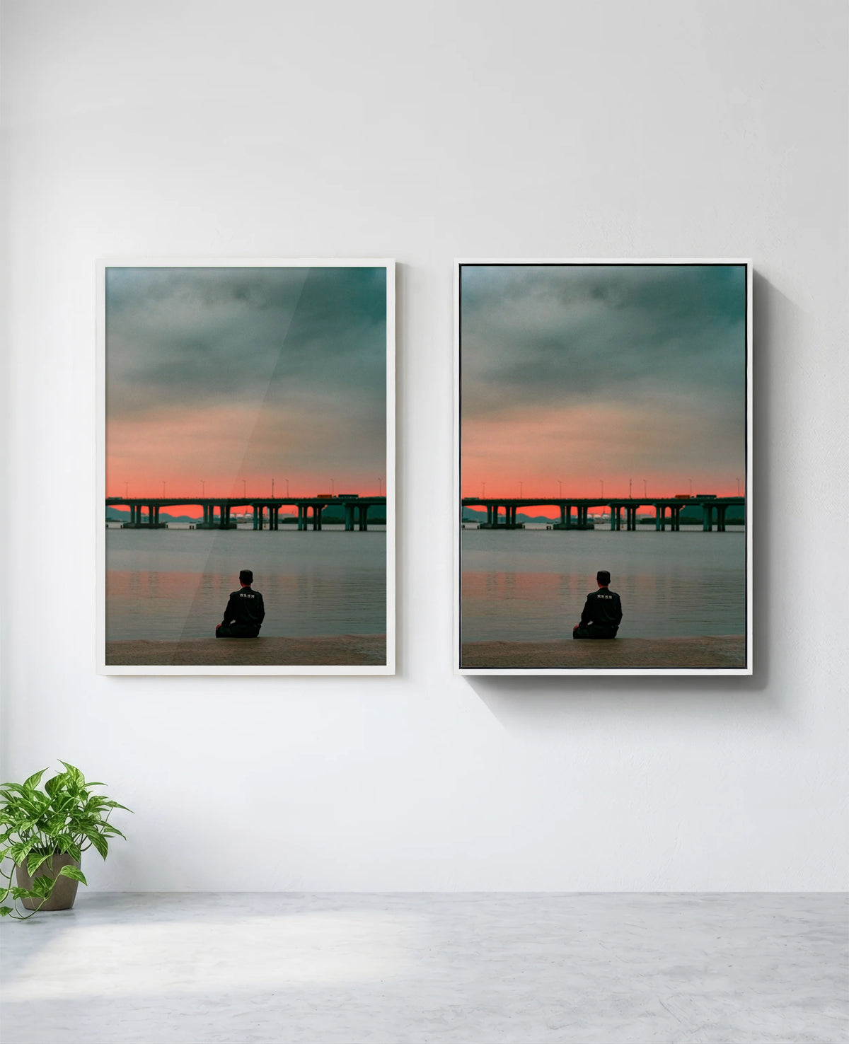 Still art print in white frame, installed on wall