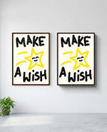 Make a Wish art print in brown frame, installed on wall