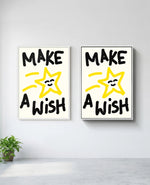 Make a Wish art print in white frame, installed on wall