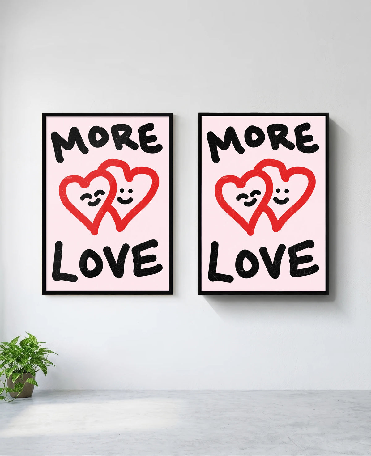 More Love art print in black frame, installed on wall