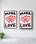 More Love art print in brown frame, installed on wall