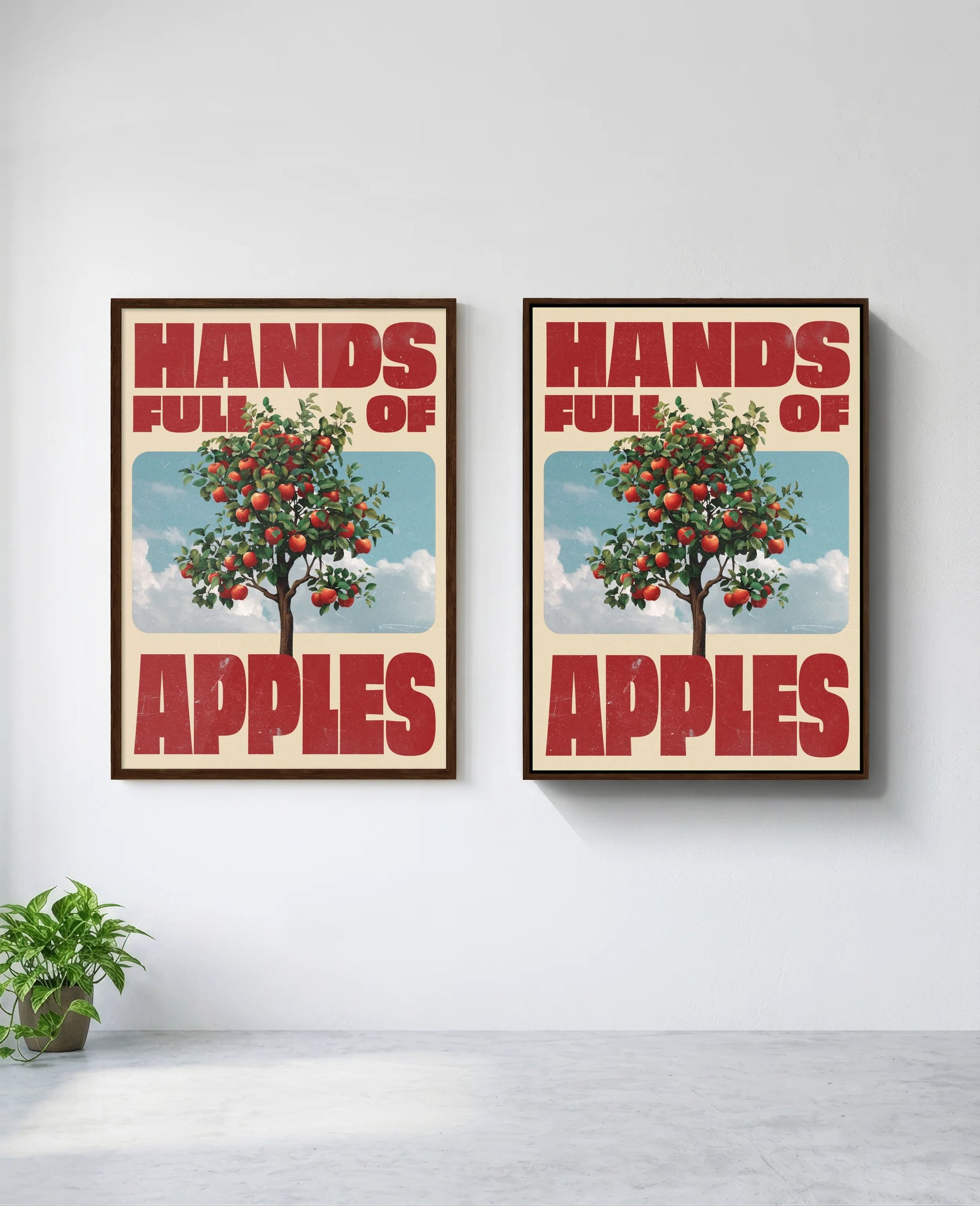 Hands Full of Apples art print in brown frame, installed on wall