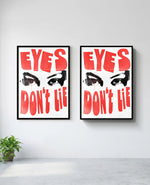 Eyes Don't Lie art print in black frame, installed on wall