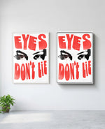 Eyes Don't Lie art print in white frame, installed on wall
