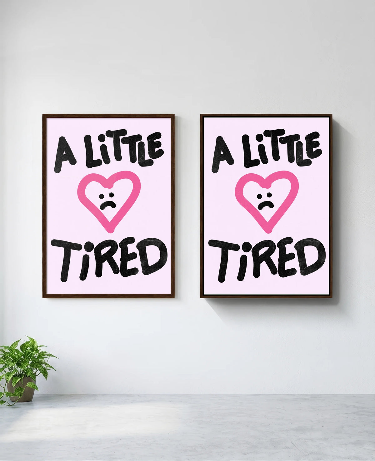 A Little Tired art print in brown frame, installed on wall