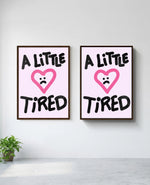 A Little Tired art print in brown frame, installed on wall
