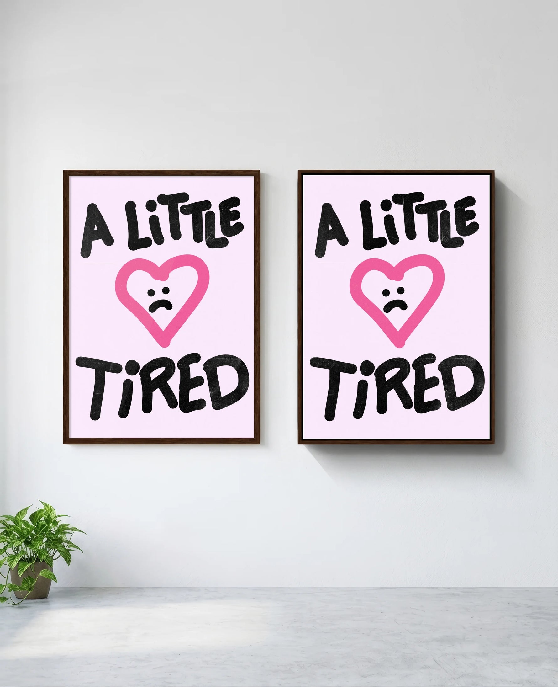 A Little Tired art print in brown frame, installed on wall