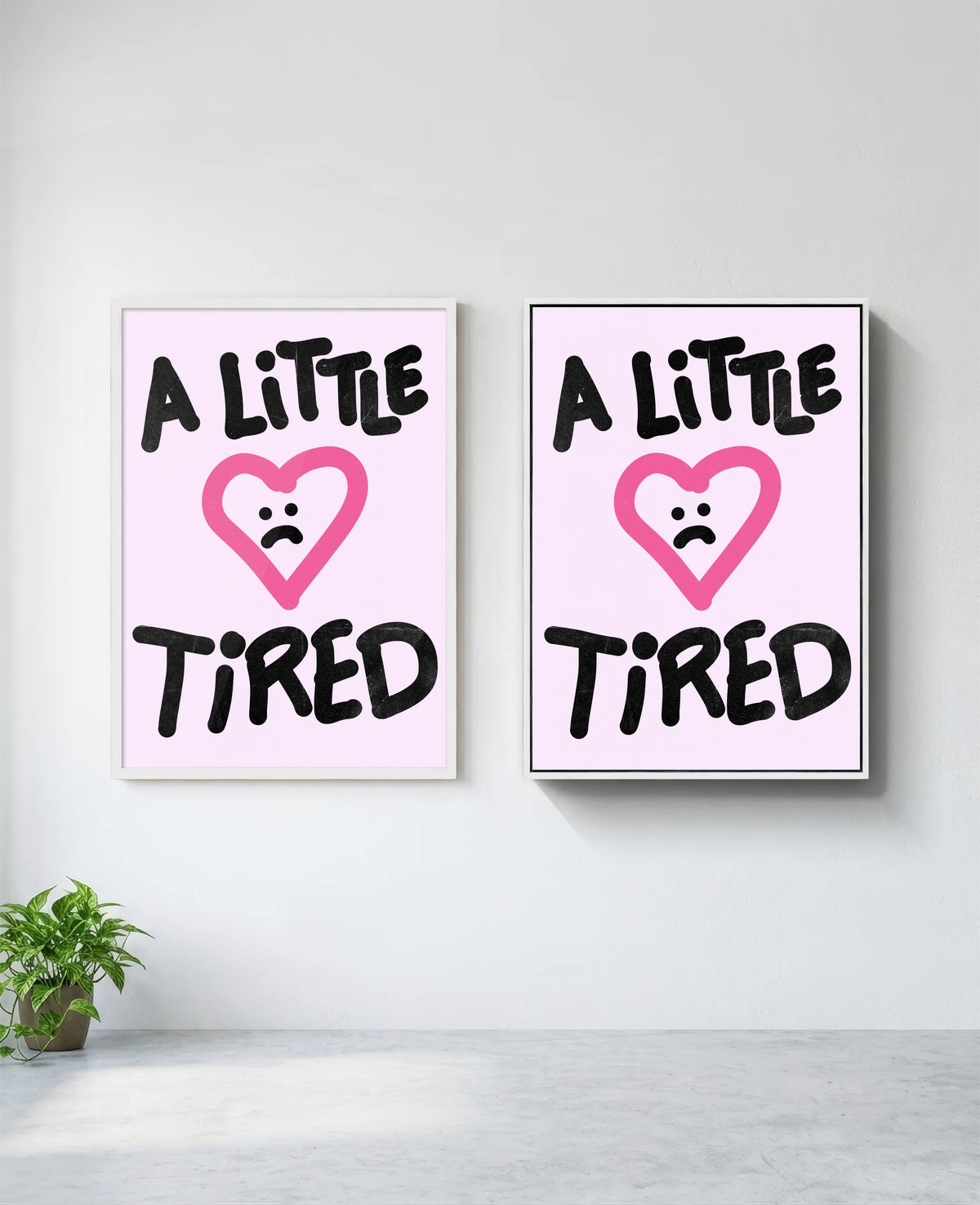 A Little Tired art print in white frame, installed on wall