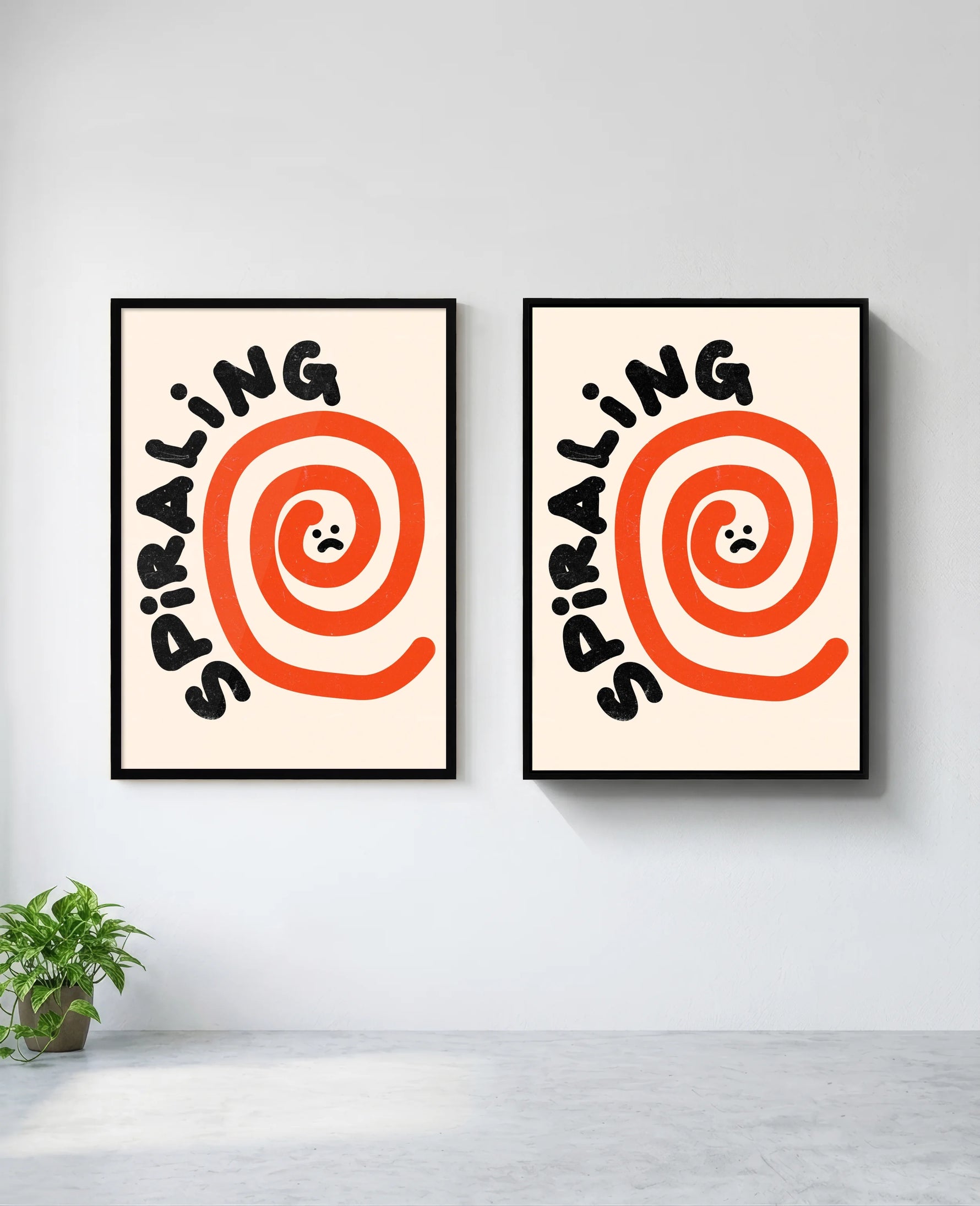 Spiraling art print in black frame, installed on wall