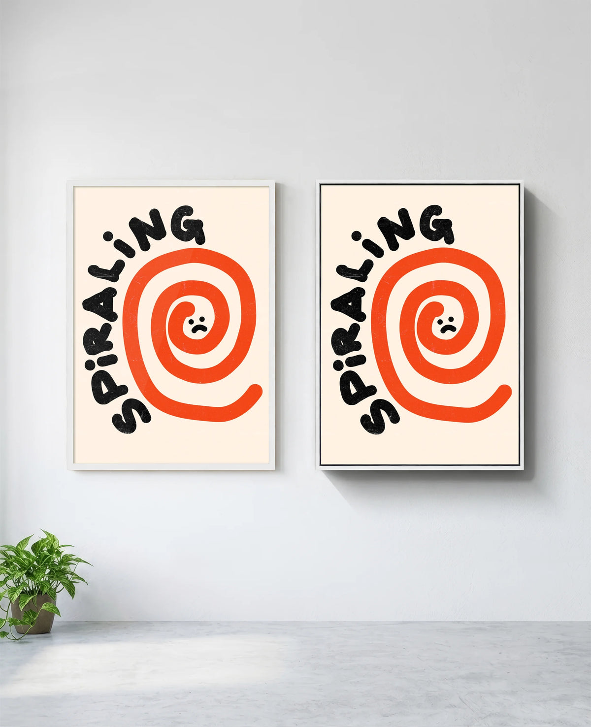 Spiraling art print in white frame, installed on wall