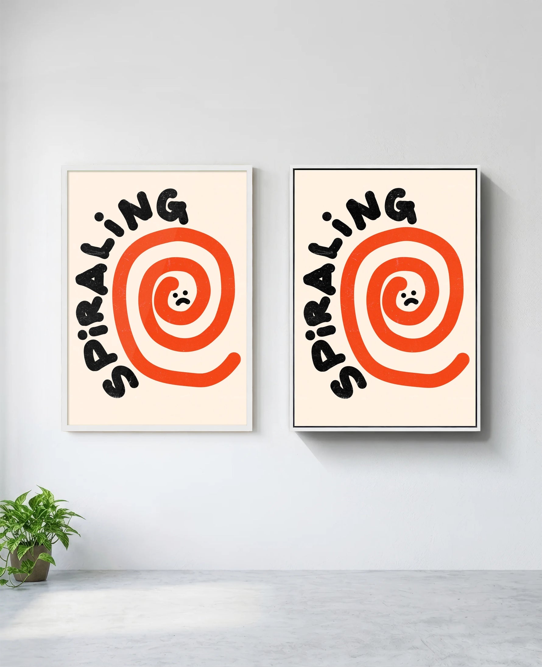 Spiraling art print in white frame, installed on wall